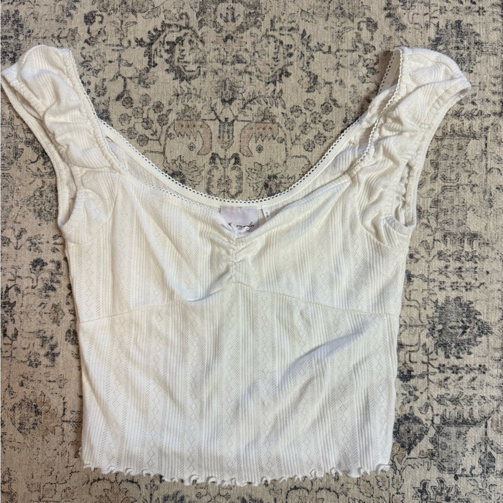 “Out from under” Top